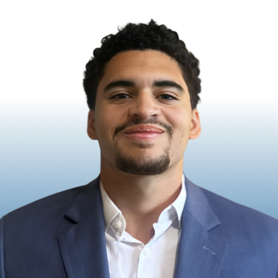 Equity team member headshot in a navy blazer and white shirt